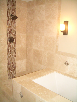 Natural stone and glass tile master bathroom installation in Fort Collins, Colorado