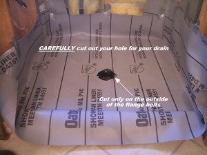 Image of the drain cut out of a shower liner
