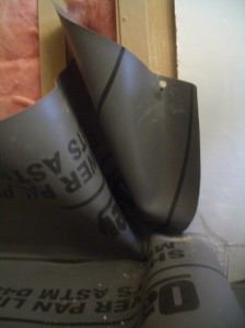 Shower pan liner on the end of the curb. Shower pan liner on the end of the curb.