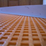 Ensuring Ditra is flat over WarmWire