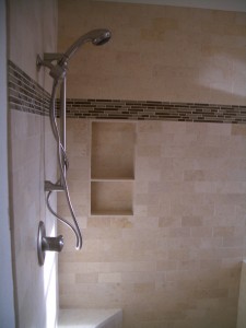 Travertine niche in subway style shower with glass liner above Travertine niche in subway style shower with glass liner above