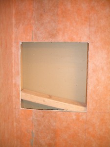 Inserting the horizontal framing for a tiled shower niche Inserting the horizontal framing for a tiled shower niche