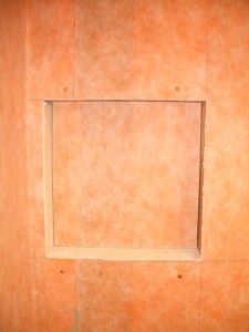 Installing the final back wall piece for your niche Installing the final back wall piece for your niche