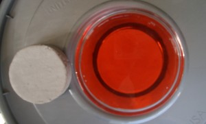 One block of SpectraLOCK grout soaking in cherry kool-aid One block of SpectraLOCK grout soaking in cherry kool-aid