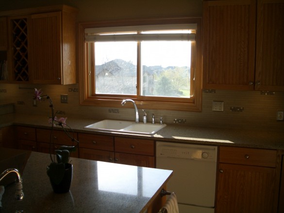 Porcelain backsplash tile installation with glass mosaic inserts in Fort Collins, Colorado Porcelain backsplash tile installation with glass mosaic inserts in Fort Collins, Colorado