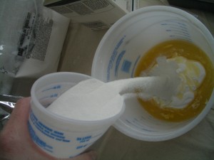 Add about 75 percent of the powder